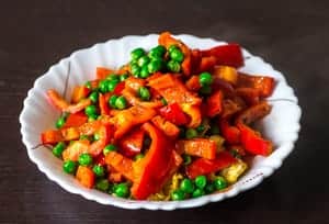 Cook red bell pepper slices and peas Cauliflower Fried Rice Recipe